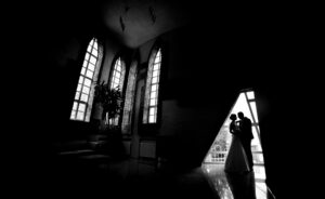 Silhouette of a bride and groom in an interior